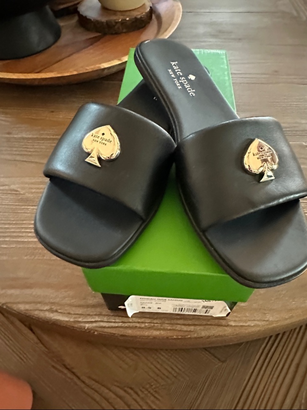 kate spade Black Slide Sandals with Gold Spade Medallions